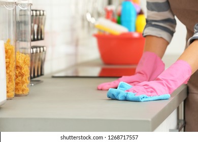 Woman Cleaning Kitchen Counter With Rag, Closeup