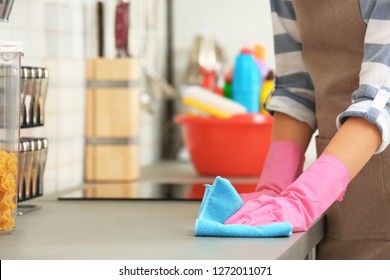 Woman Cleaning Kitchen Counter With Rag, Closeup