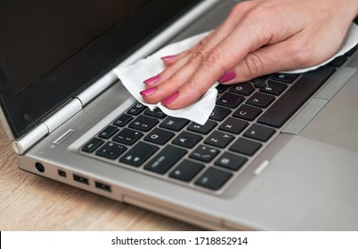 Woman Cleaning Laptop Keyboard With White Tissue, Detail On Her Fingers Holding Paper Towel - Disinfection Concept