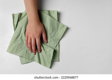 Woman Cleaning Light Table With Paper Towel, Top View. Space For Text