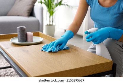 Woman Cleaning A Wooden Table At Home, Hygiene And Housekeeping Concept, Hands Close Up