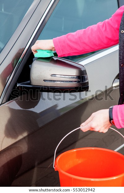 Woman cleans the\
car