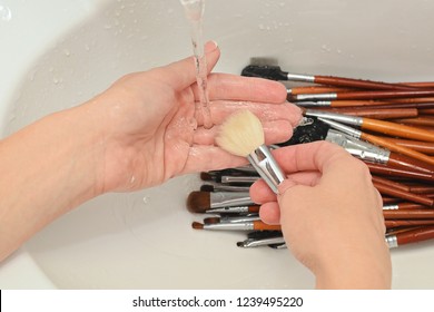 Woman Cleans Makeup Brush Under Running Water