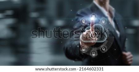 Woman clicks on virtual computer screen to data cloud for synchronization.