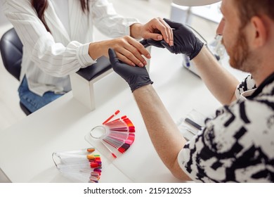 Woman Client Having Nail Manicure In Nail Art Studio