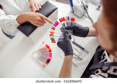 Woman Client Having Nail Manicure In Nail Art Studio