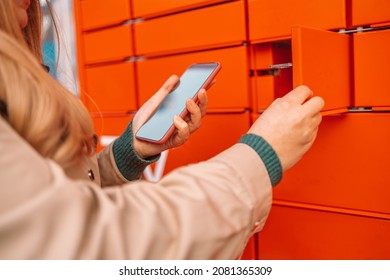 Woman client using automated self service post terminal machine or locker. Mail shipping concept