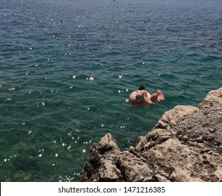 Woman Cliff Diving In Nice France