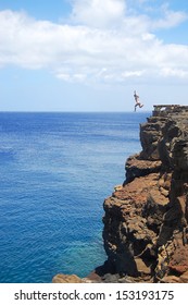 Woman Cliff Jumping In Hawaii