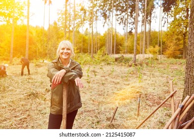 Woman As Climate Protector Helps With Reforestation Of Forest In Summer