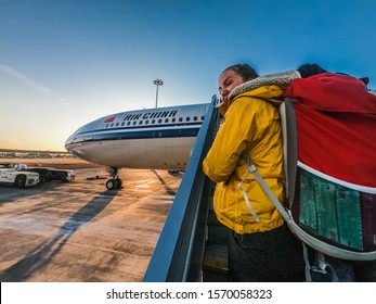 Woman Climbing Stairs To Air China Plane - Beijing China 25.11.2019