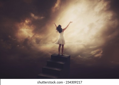 A Woman Climbs To The Top Of A Tall Staircase To Worship.