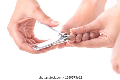 Woman Clipping Her Toenails. Isolated On White Background.