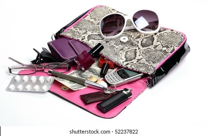 Woman Clutch Bag With Some Of Its Contents.