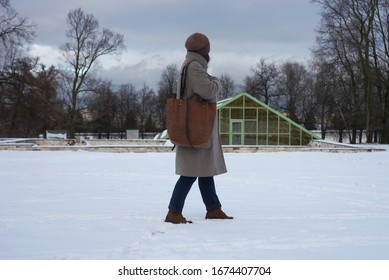 Woman In Coat With A Large Leather Bag On His Shoulder