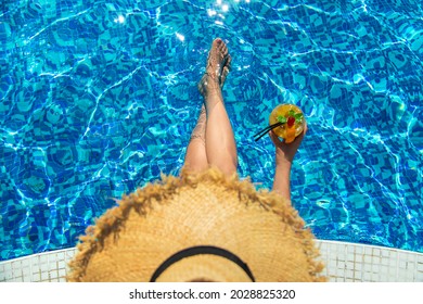 Woman With Cocktail Near The Pool. Selective Focus. Drink.