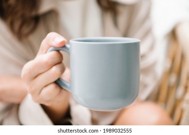 Woman with a coffee cup mockup