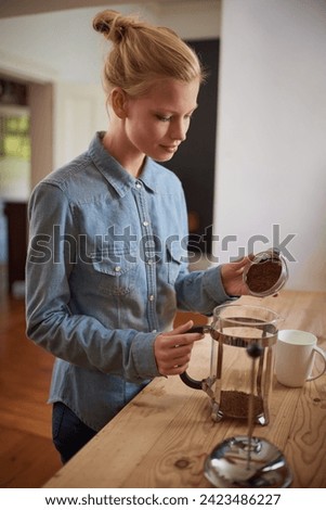 Woman, coffee and french press in kitchen or prepare with plunger for morning beverage, caffeine or drinking. Female person, counter and breakfast equipment with mug for espresso, cappuccino or home
