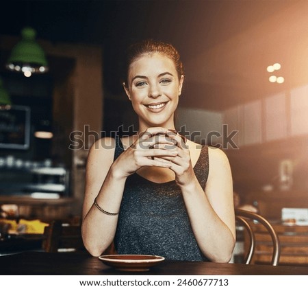Woman, coffee shop and portrait with latte and happy customer with smile and table. Cup, restaurant and relax university student with college break, cafe and tea in store with hot drink and mug