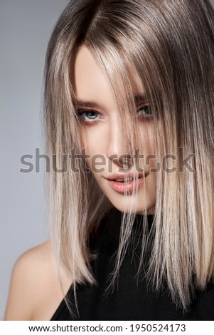 Woman with colored hair color of a blonde. Coloring hair woman model in ash color. Portrait of a girl Stock photo © 