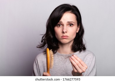 Woman With Comb In Hands Problem Hair