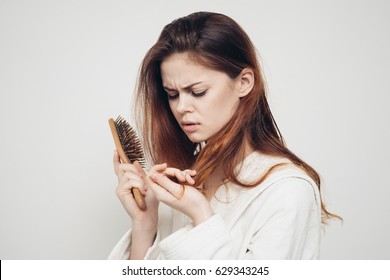 Woman With A Comb In Her Hands Problem Hair