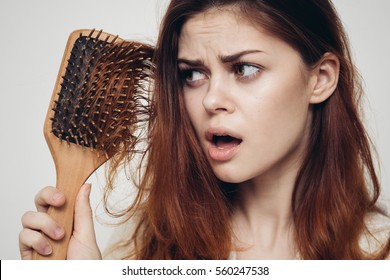 Woman With A Comb In His Hand And Problematic Hair