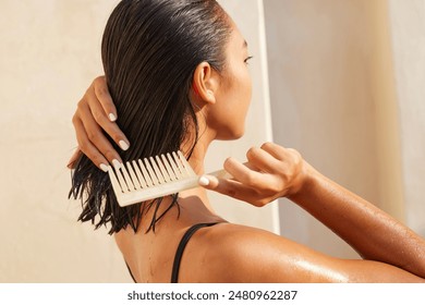 Woman Combing Wet Hair With Wooden Comb In Bright Sunlight, Emphasizing Haircare, Wellness And Summer Vibes.