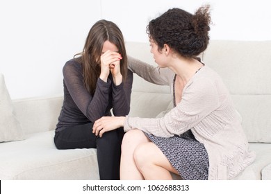 woman comforting a female friend