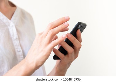 Woman communicaties by phone; white background