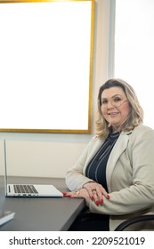 Woman In A Company Sitting At The Table, Older Businesswoman Sitting In Front Of Her Computer