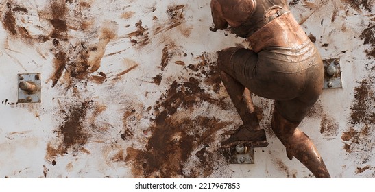 Woman Competing In A Mud Run Race