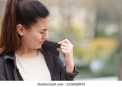 Woman Complaining About Clothes Bad Smell In The Street