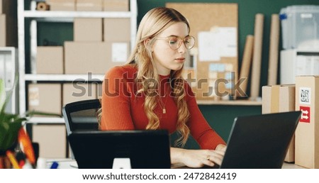 Woman, computer and logistics with boxes for e commerce, package and startup business planning or research. Young seller or entrepreneur with web order, courier or services for online shop on laptop