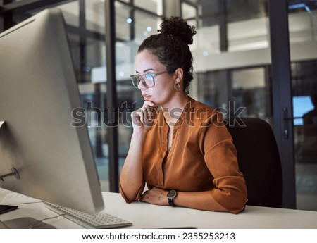 Woman, computer and office with glasses show reflection on face while working overtime. Girl, thinking and idea read analytics, email or communication online at work late at business in the night