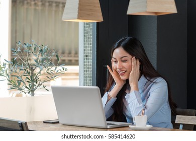 Woman With Computer Is Surprised.space For Text