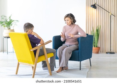 Woman Conducts An Explanatory Conversation With A Difficult Teenager. School Psychologist. Full-length Image.