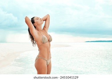 Woman, confidence and bikini at beach or tropical island for holiday, summer vacation and relax with blue sky. Person, swimsuit or tourist at seaside for sun tan, clean air and fun in Maldives water - Powered by Shutterstock