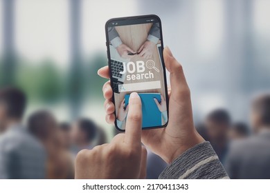 Woman connecting with her smartphone and looking for a job online, people in the background, POV shot - Shutterstock ID 2170411343