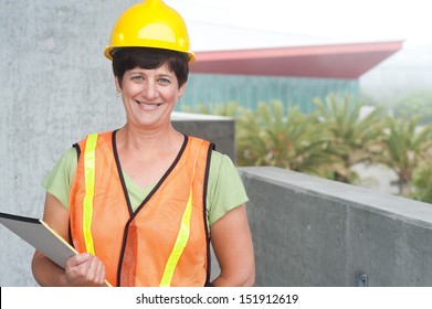 Woman Construction Worker In Hard Hat Taken Outside