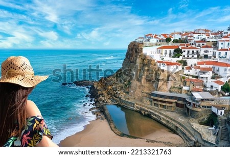 Woman contemplating the view of Azenhas do Mar region of Lisbon, Sintra, Portugal - Travel concept.