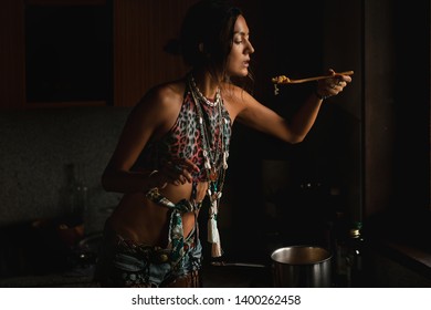 Woman Coocking In The Kitchen Against Window