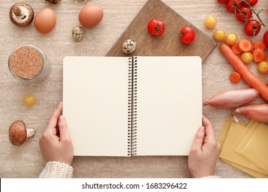 Woman With Cook Book At Table, Top View