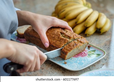 Woman Cook Cuts Banana Bread