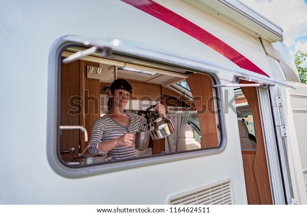 Woman\
cooking in camper, motorhome interior VR. Family vacation travel,\
holiday trip in motorhome, Caravan car\
Vacation.