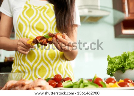 Woman cooking kebab