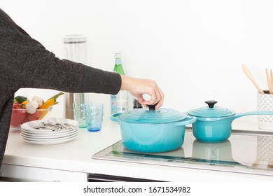 Woman cooking in the kitchen - Powered by Shutterstock