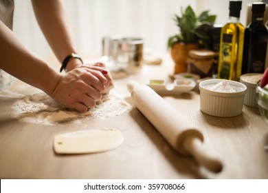 Woman Cooking In The Kitchen.Healthy Food And Lifestyle.Eating In.Cooking At Home.Prepare Dough For Homemade Whole Grain Bread.Woman Kneading Dough With Her Hands.Carbohydrates.Dieting Concept.