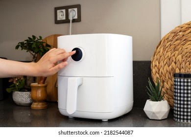  Woman cooking with modern Air fryer - Shutterstock ID 2182544087