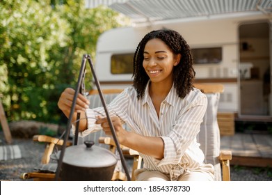 Woman Cooking Near The Rv, Camping In A Trailer